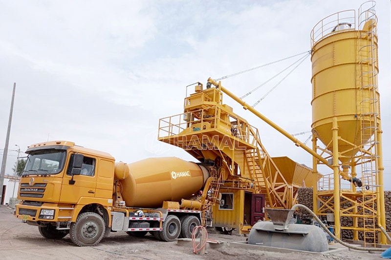 Concrete Mixer truck is collecting concrete from concrete mixer