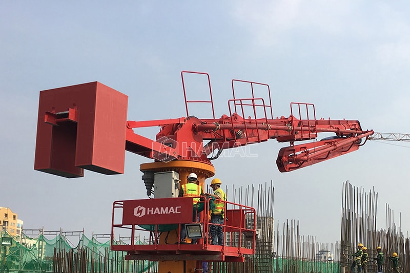 Self-climbing concrete placing boom